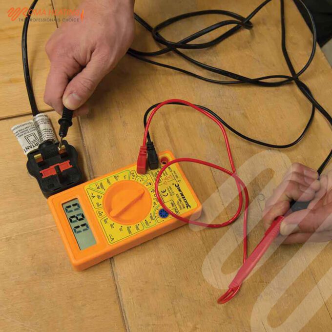 Multimeter testing a plug